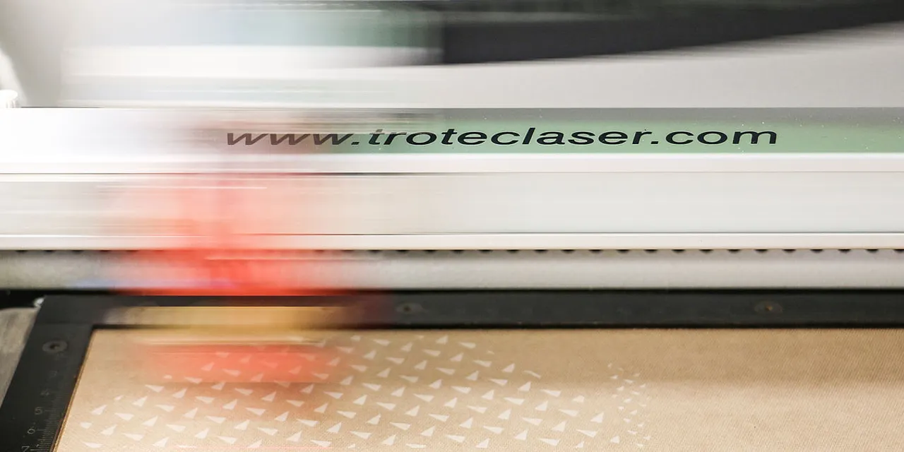 Trotec CO₂ laser cutter engraving detailed pattern on material surface