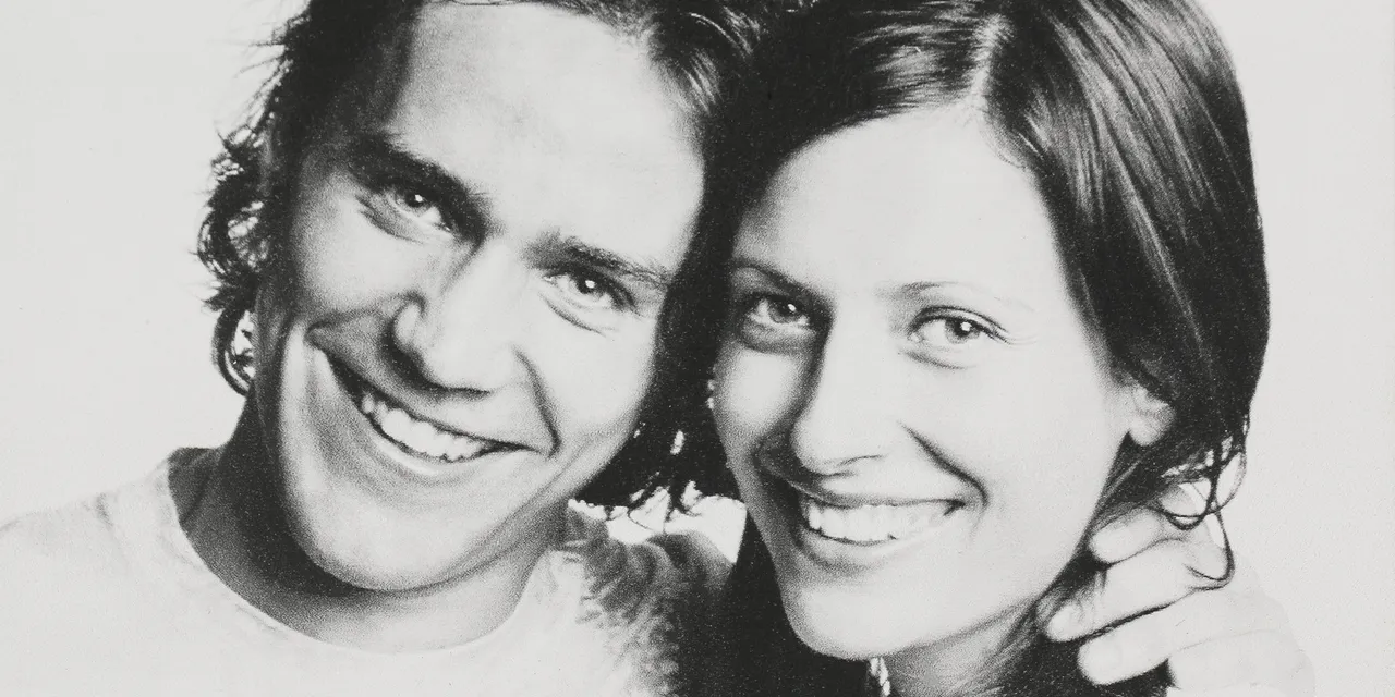 Laser-engraved photo of smiling couple on wood using Trotec Speedy CO₂ laser machine