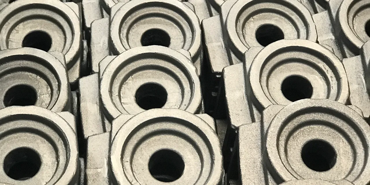 Stack of metal components ready for laser marking with Trotec SpeedMarker systems