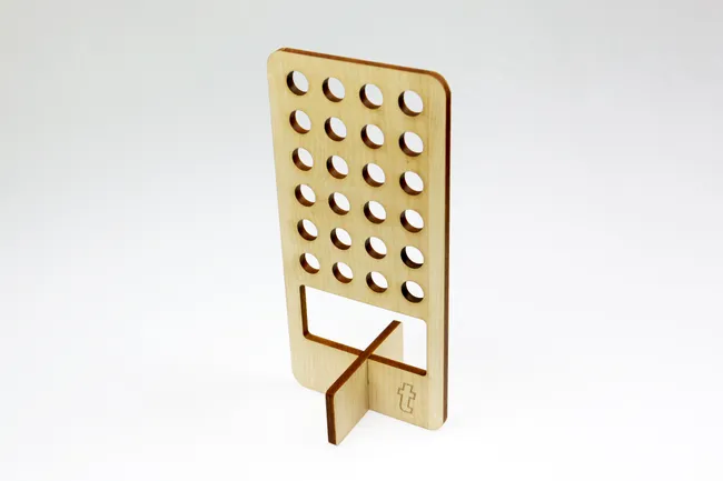 Laser-cut wooden display stand with holes, made using Trotec CO₂ laser cutter
