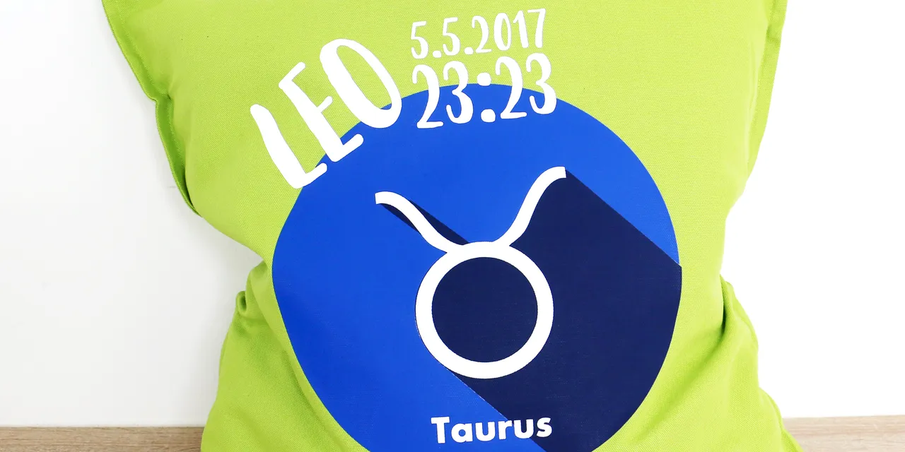 Green pillow with zodiac sign Taurus design and custom date made using Trotec laser engraving machine