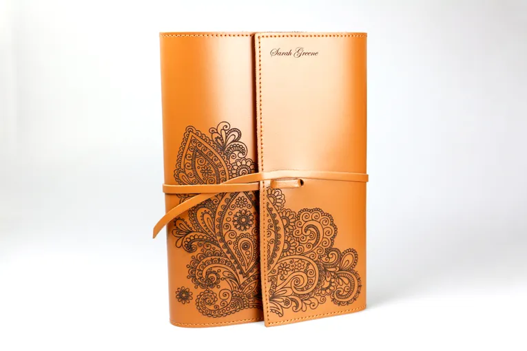 Custom leather notebook with paisley design and name engraved using Trotec CO₂ laser