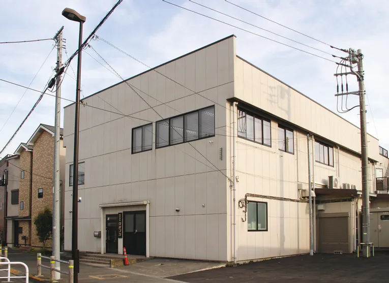 Trotec laser cutter facility exterior with modern industrial design and large office windows