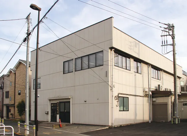 Trotec laser cutter facility exterior with modern industrial design and large office windows