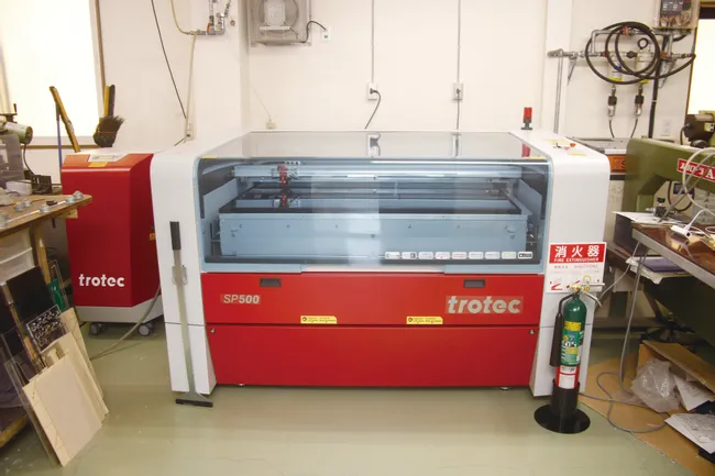 Trotec SP500 laser cutter and engraver in a workshop setting