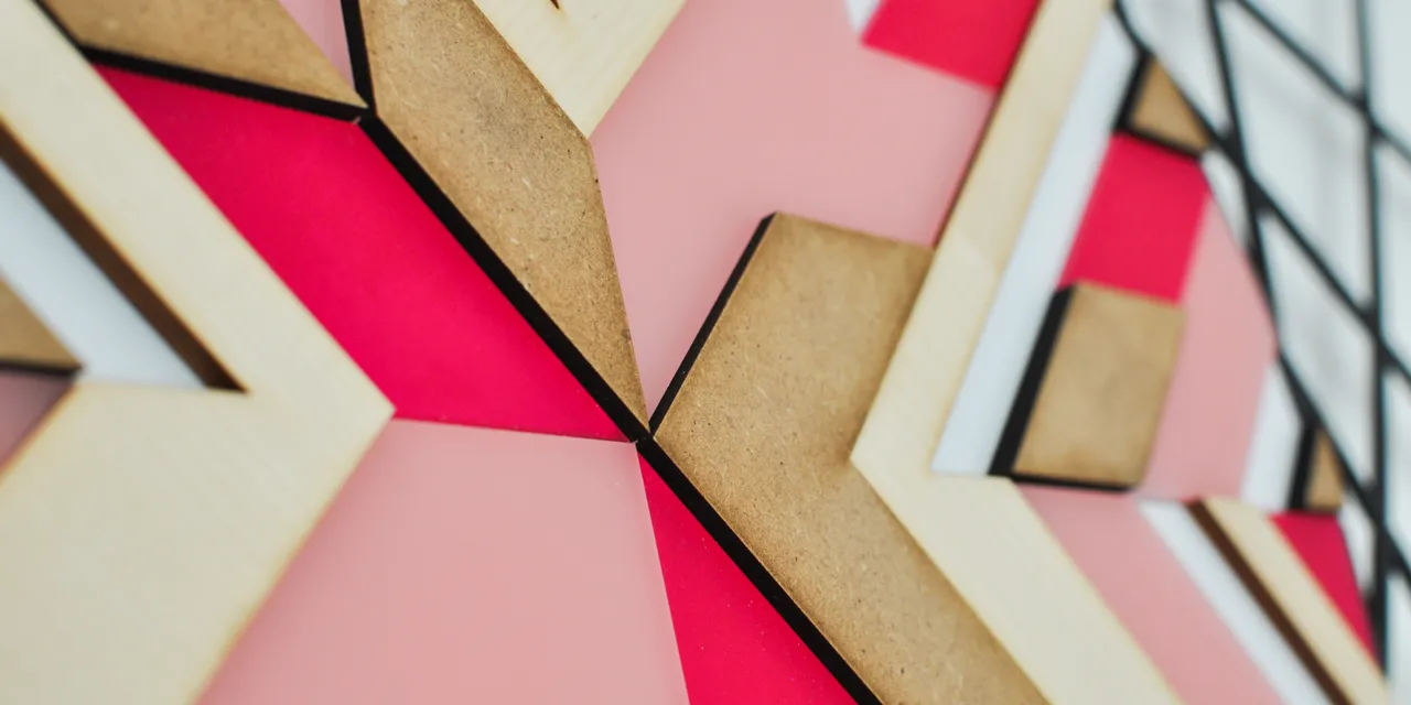 Laser-cut acrylic and wood geometric pattern created with Trotec laser cutter