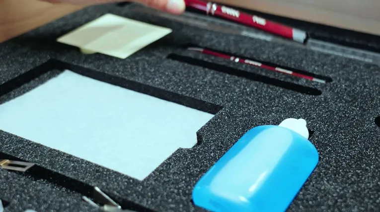 Trotec laser cutter maintenance kit with tools and cleaning fluid in foam insert