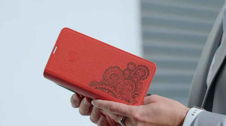 Engraved leather wallet with ornate design created using Trotec CO₂ laser technology