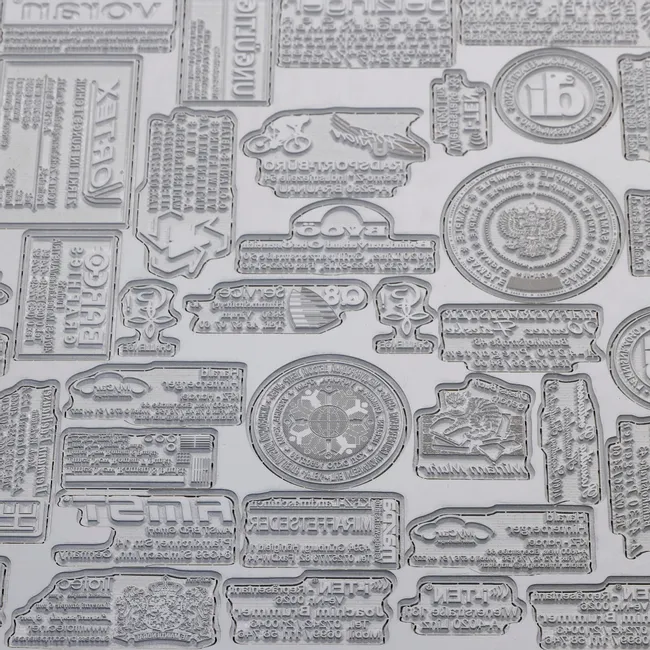 Laser-engraved rubber stamps created with Trotec laser cutter showing detailed text and logo designs