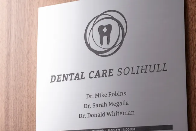Laser-engraved dental office sign created with Trotec CO₂ laser engraver on brushed metal