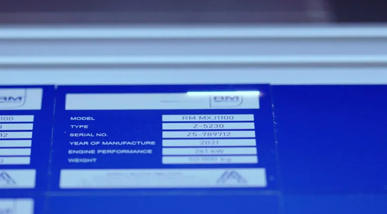 Laser-marked metal nameplate engraved with serial and model number using Trotec laser marking machine