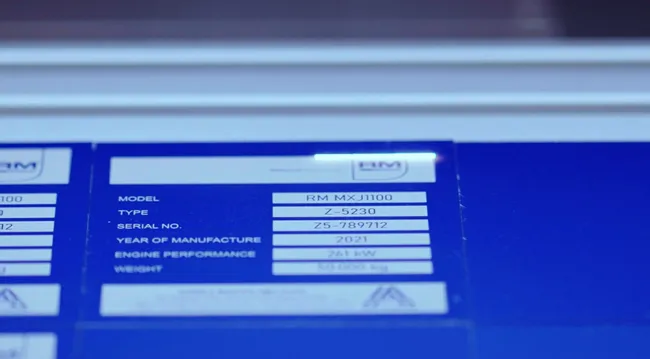 Laser-marked metal nameplate engraved with serial and model number using Trotec laser marking machine