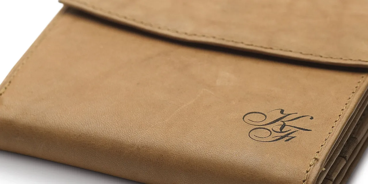 Leather wallet personalized with initials using Trotec CO₂ laser engraving machine