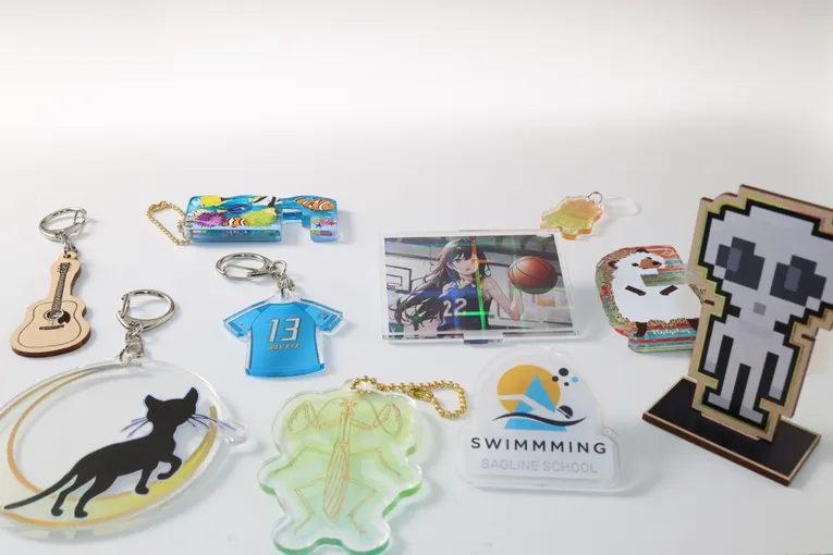 Custom engraved acrylic keychains made with Trotec laser cutter in various shapes and designs