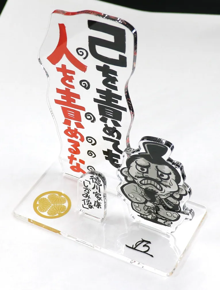 Engraved acrylic display with cartoon figure created using Trotec laser cutter