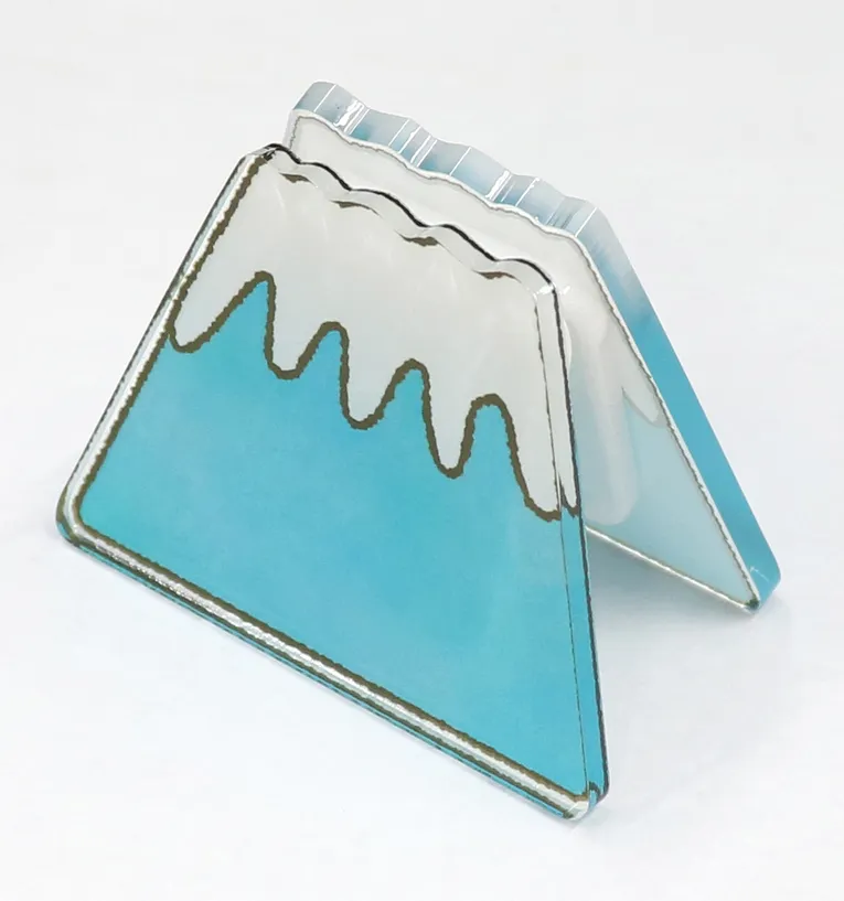 Acrylic mountain-shaped piece with snowcap design cut using Trotec laser cutter