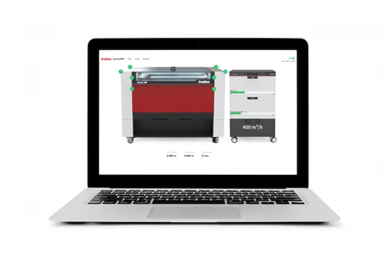 Laptop displaying Trotec Speedy series laser cutter with Ruby software interface