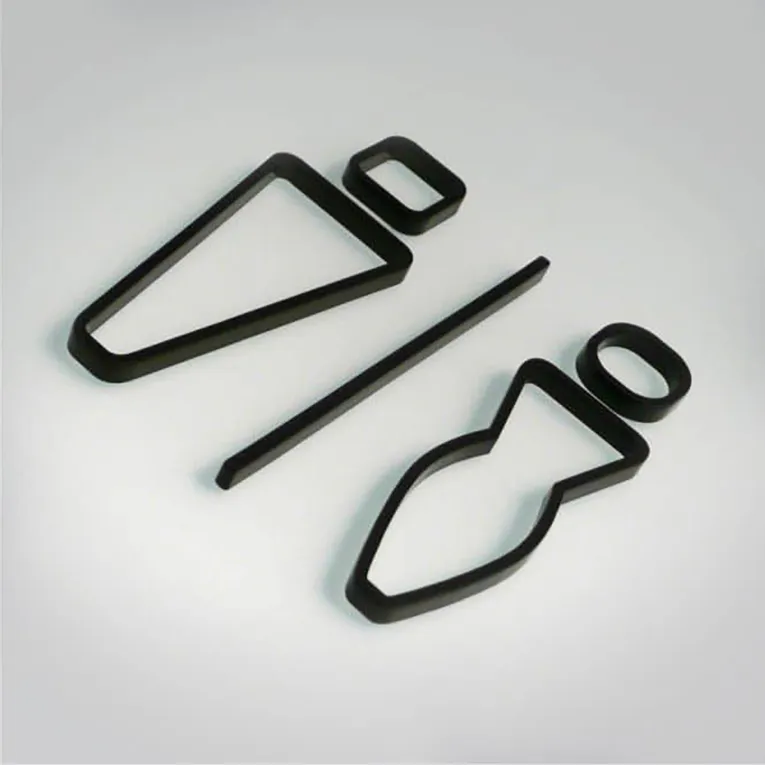Laser-cut acrylic shapes for restroom signage made with Trotec CO₂ laser cutter