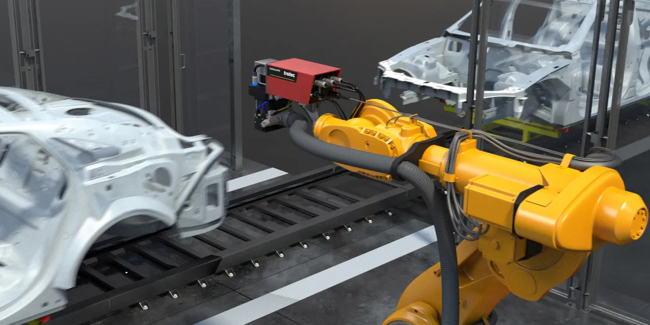 Trotec SpeedMarker laser marking system integrated with robotic arm on automotive production line