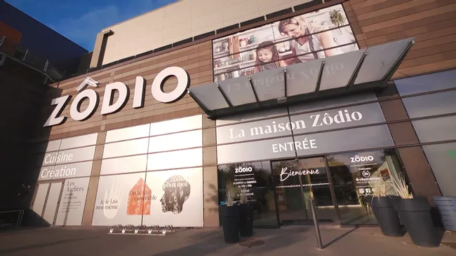 Exterior of La maison Zôdio store with large signage and glass entrance