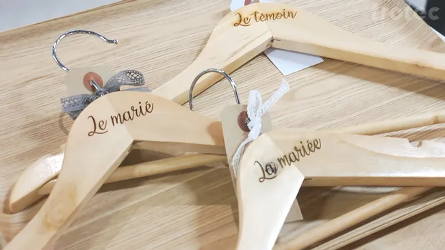 Wooden coat hangers engraved with Trotec laser cutter for wedding party labeling