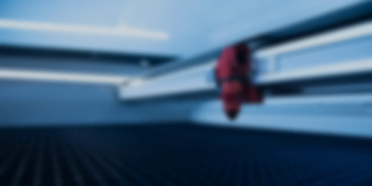 Close-up view inside Trotec® 快乐幸运8手机澳洲版 Speedy series CO₂ Laser 今日官方最新168体彩澳洲8结果幸运号码记录查询 cutter with engraving head and honeycomb cutting table