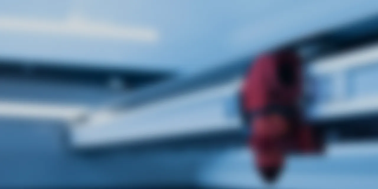 Close-up view inside Trotec Speedy series CO₂ laser cutter with engraving head and honeycomb cutting table