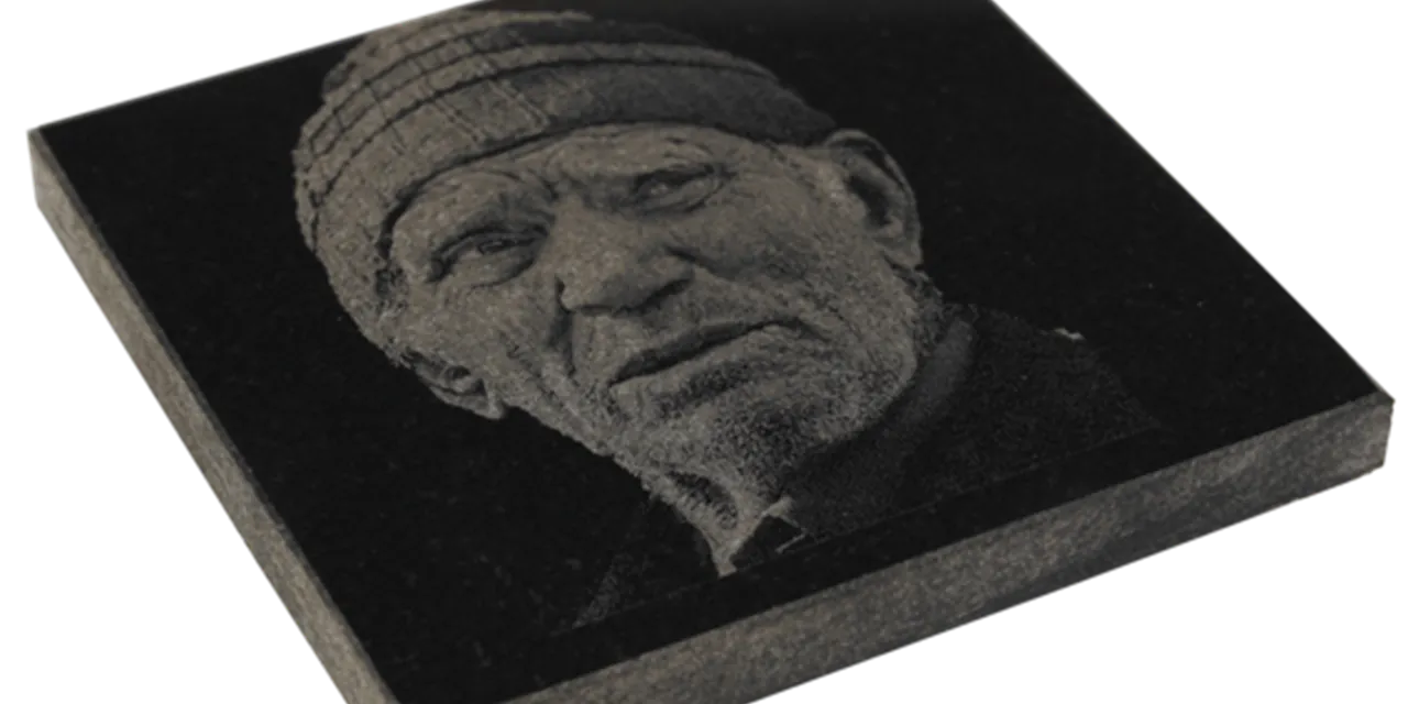 Photo-engraved portrait on black granite using Trotec laser engraving machine