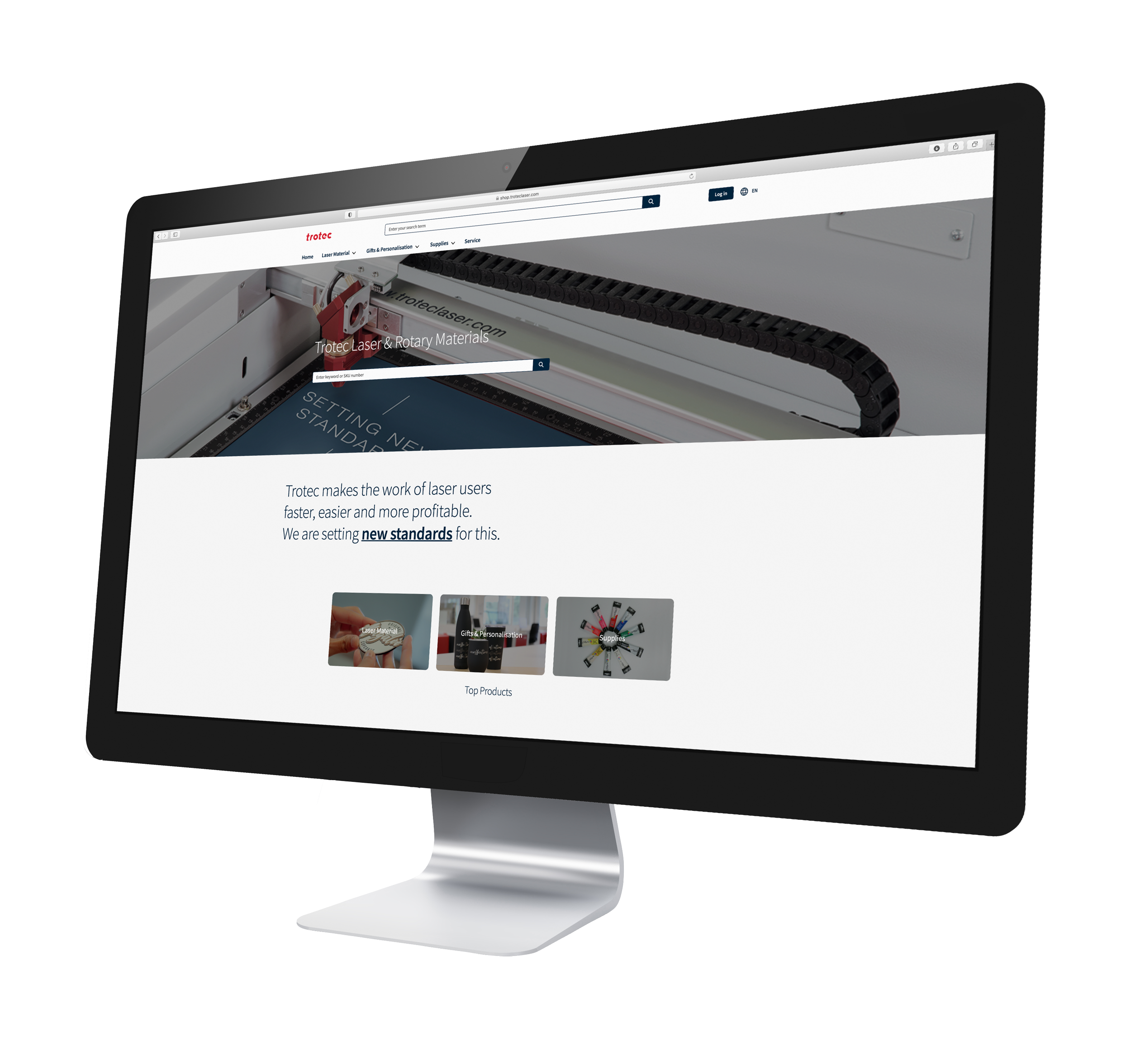 Trotec® 快乐幸运8手机澳洲版 website displayed on a monitor featuring Laser 今日官方最新168体彩澳洲8结果幸运号码记录查询 engraving materials and Speedy series machine